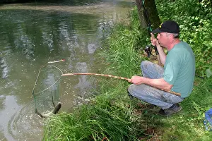 Anglers: Fisherman / Angler - catches European Chub, a freshwater