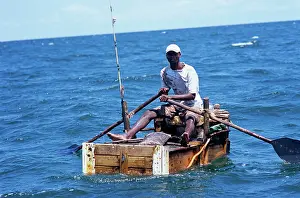 Mozambique: Fisherman hand lining for squid