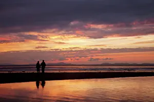 Hobbies: Two fishermen enjoying the last cast looking towards