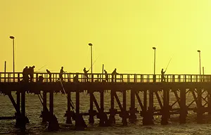 Piers: Fishermen - sunset over the Atlantic Ocean at the