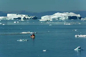 Travelling: Fishing Boat travelling between melting
