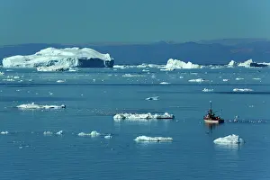 Travelling: Fishing Boat travelling between melting