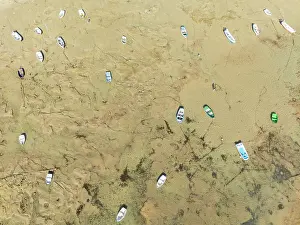 Boats: Fishing boats at low tide in the town of Cádiz