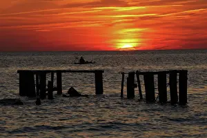 Piling: Fishing at sunset, Delaware bay. New Jersey