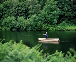 Anthony Harrison: FISHING - for trout from boat, angler casts line
