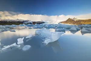 Estuary: Fjallsarlon glacier lagoon, icebergs with glacier