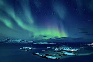 Fiords: Fjord with islands in winter and the northern lights