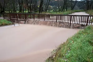 Flash: Flash flood - damage to footbridge after torrential