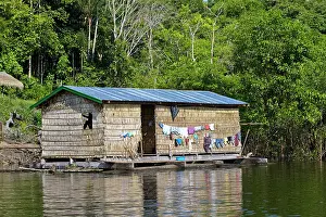 Tribal: Floating house on the Purus river Manaus Amazon
