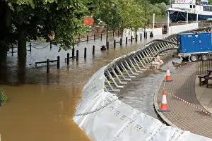 Severn: Flood barriers alongside flooded River Severn in spate