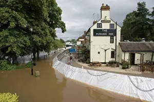 Floods: Flood barriers outside Plough Inn fooded alongside