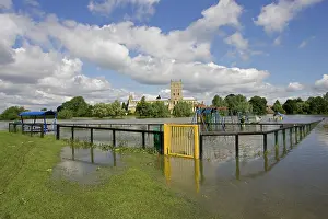 Floods: Flooded childrens playground with Tewkesbury Abbey