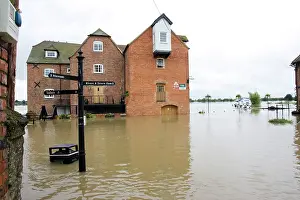 Opposite: Flooding - Abbey Mill surrounded by flood River