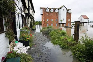 Opposite: Flooding - Abbey Mill surrounded by flood River