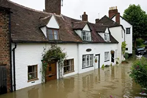 Baling: Flooding - Baling water from flooded riverside