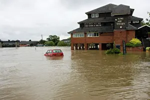 Avon: Flooding - Car submerged in marina car park in