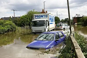 Lorry: Flooding - cars and lorries partly submerged on