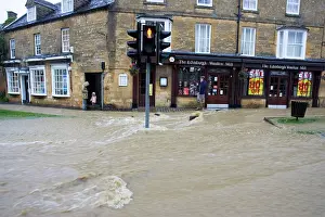 Worcestershire: Floods - Torrents of flood water in high street