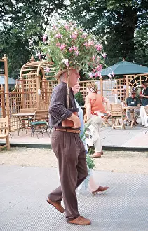 Hobbies: FLOWER SHOW - Hampton Court, man with flowers