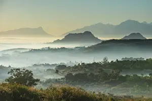 Surrounding: Fog over the mountains at sunrise, surrounding Blantyre