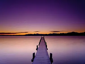 Chiemgau: Footbridge at Chiemsee at dawn, behind the Chiemgau