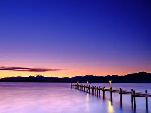 Chiemgau: Footbridge at Chiemsee at dawn, behind the Chiemgau