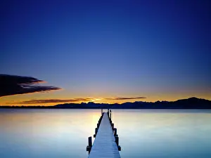 Chiemgau: Footbridge at Chiemsee at sunrise, behind the Chiemgau