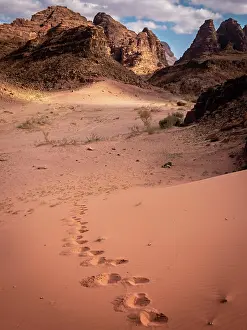 Loneliness: Footsteps walking alone in Wadi Rum desert, Jordan. M