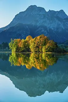 Artificial: Forggensee in autumn, behind it the Sauling, Ammergau