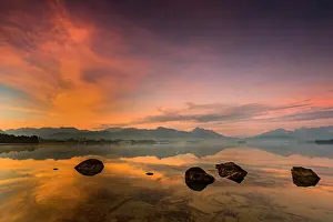 Bergen: Forggensee with reflection of the cloudy sky and
