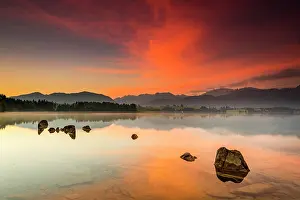 Artificial: Forggensee with reflection of the cloudy sky and