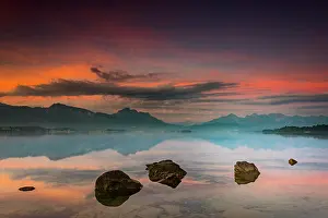 Artificial: Forggensee with reflection of the cloudy sky and