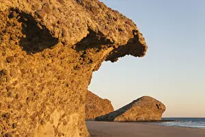 Cabo: Fossilized lava tongues and walls at the beach Playa