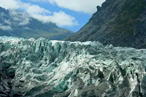 Calving: Fox Glacier - river of ice cutting through glacial