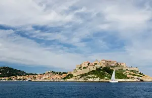 Manmade: France, Corsica. Cirrus clouds above old