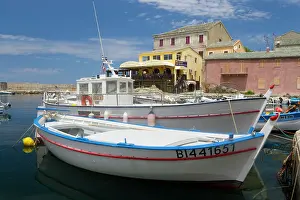 Manmade: France, Corsica. Fishing boats at village