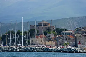 Sailboat: France, Corsica. Mast of boats and breakwater