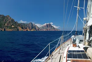 Approaching: France, Corsica. Sailboat approaching Cape