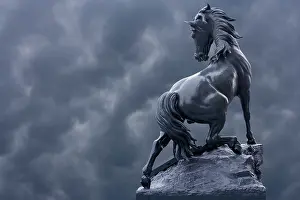 Paris: France, Paris. Horse sculpture against storm