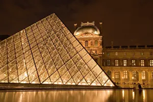 Pyramid: France, Paris. The Louvre at twilight