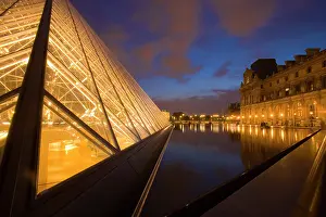 Pyramid: France, Paris. The Louvre at twilight