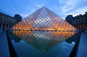 Glass: France, Paris. The Louvre at twilight