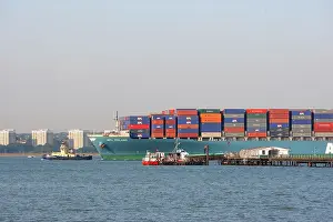 Ports: Freight Ship - with tug guiding it into port