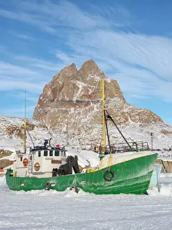 Fishery: The frozen harbor of Uummannaq during winter in