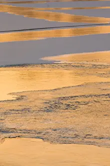 Zigzag: Frozen Lake - ice forming a pattern at sunset in