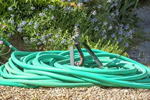 Gravel: Garden hose coiled on gravel
