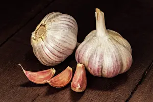 Onion: Garlic and cloves on old wooden background