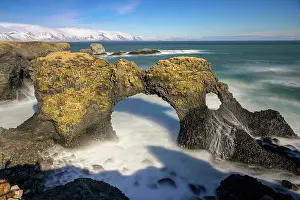 Erode: Gatklettur at sunrise, rock arch in the sea, Arnarstapi