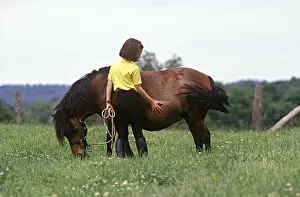 Cherished: Girl caressing her pony