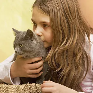 Stroking: Girl - cuddling grey cat